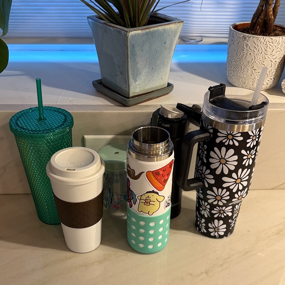 Six variety water bottles and coffee mugs